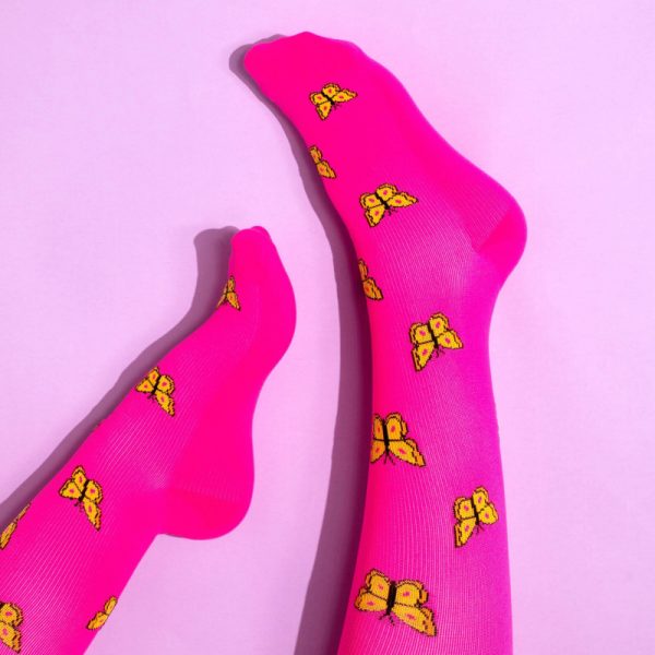 neon pink socks with yellow butterflies